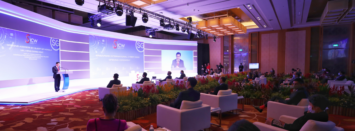 Audience at Singapore International Cyber Week with speaker on stage.